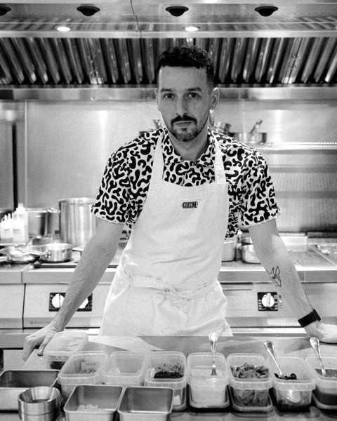 Ismael Whitehead, head chef at [CUISINE] Bangkok, at the pass of the open kitchen in Silom